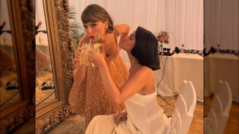 Taylor Swift and Selena Gomez toasting ahead of Gomez's wedding