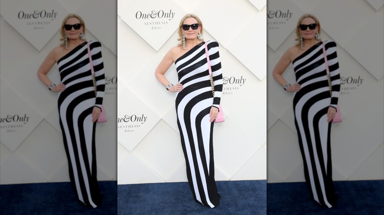 Kim Cattrall wearing a black and white striped dress