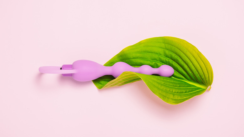 Pink bubble anal plug on pink background