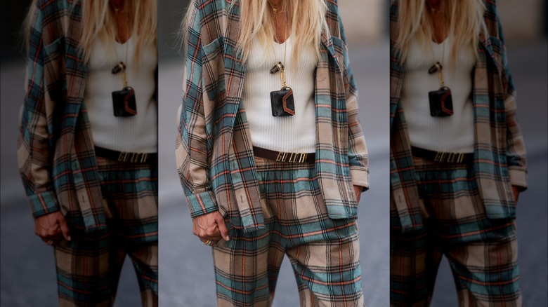 A woman wearing matching plaid 