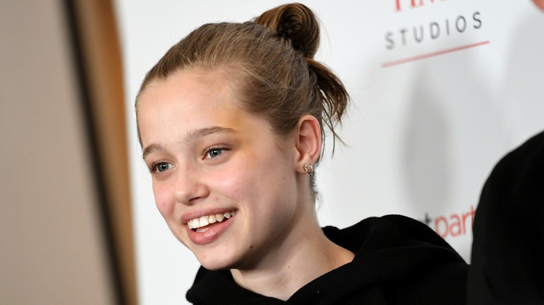 Shiloh Jolie smiling on the red carpet in 2021