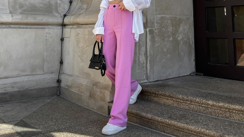 person with pink pants and sneakers
