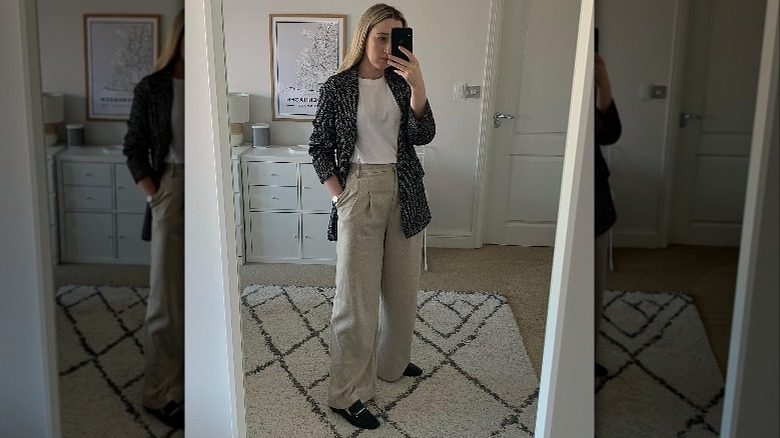 woman taking mirror selfie