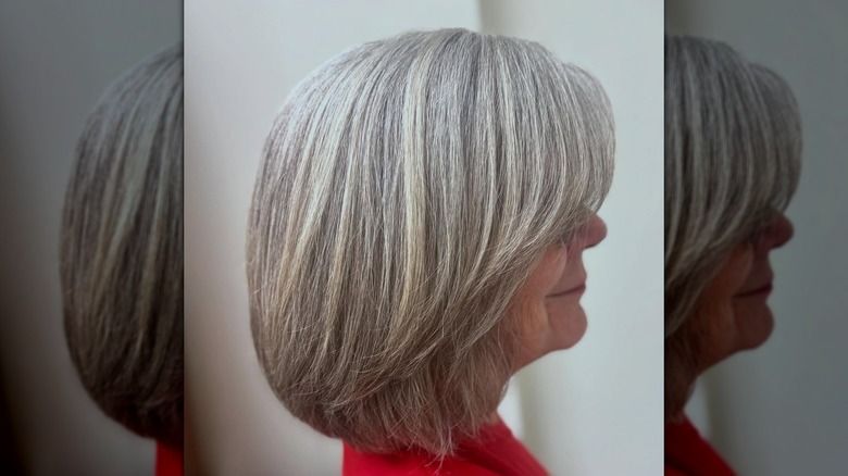 Older woman with fresh hair cut styled into a frayed bob