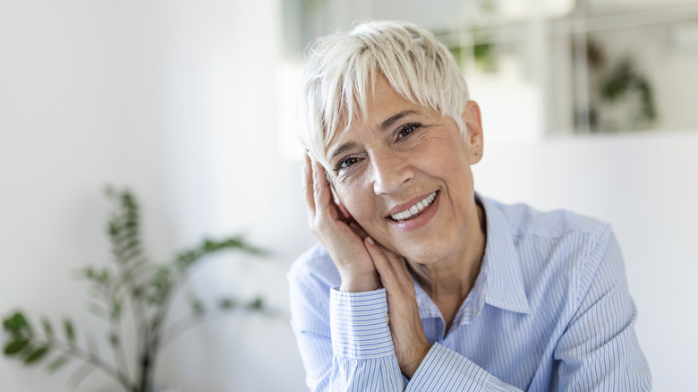 Older woman with gray pixie cute
