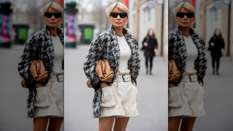 Woman walking on the street in paperbag shorts