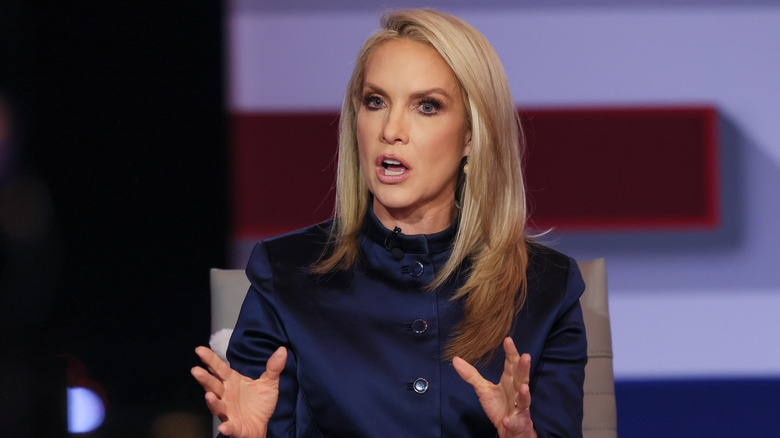 Dana Perino sitting at a desk