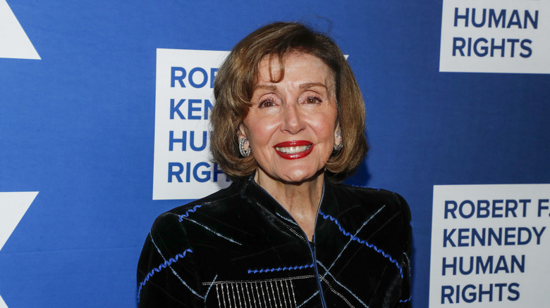 Nancy Pelosi with Robert F. Kennedy Human Rights in background