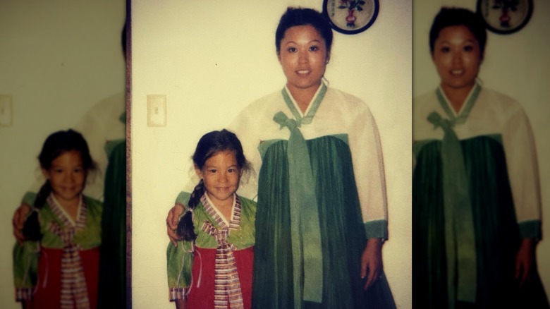 Joanna Gaines smiling side by side with lookalike mom in throwback image