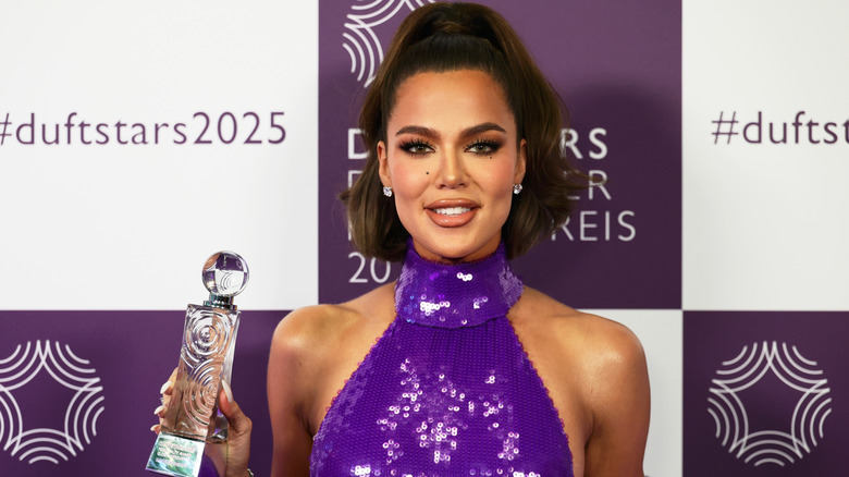 Khloe Kardashian in a purple sequin halter top with brown hair