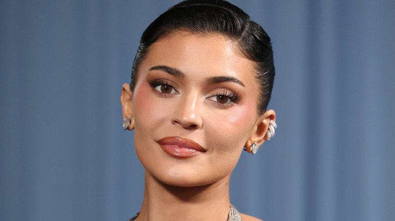 Kylie Jenner with her hair pulled back at an event