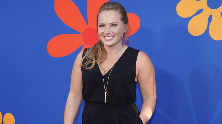 Mina Starsiak Hawk smiles on the red carpet