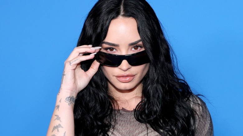 Demi Lovato looking over her sunglasses