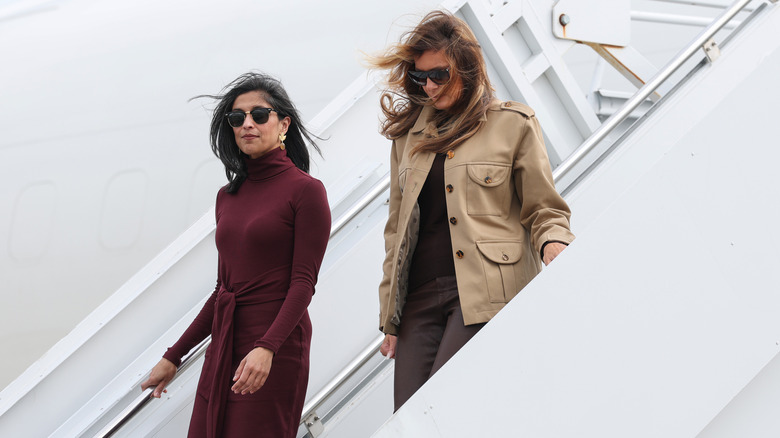 usha vance and melania trump depart a plane as they arrive at Albert J. Ellis Airport en route to Camp Lejeune on November 19, 2025