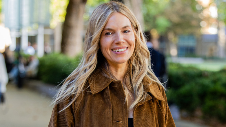 Sienna Miller wearing brown corduroy jacket