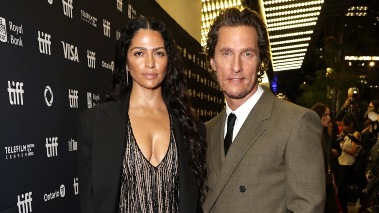 Camila Alves McConaughey and Matthew McConaughey standing side by side on the red carpet