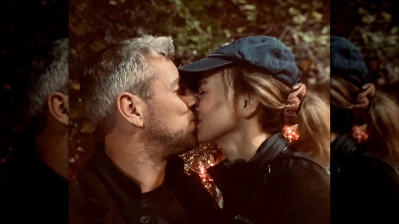 Ant Anstead kissing Renee Zellweger while she's in a blue ball cap