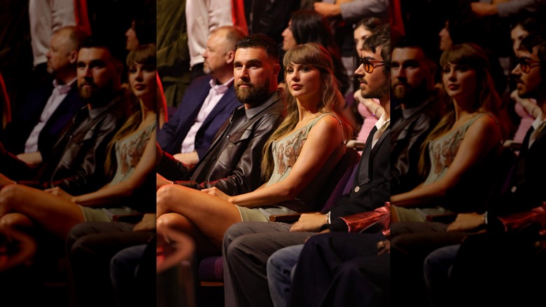 Travis Kelce and Taylor Swift sitting together in an awards show audience