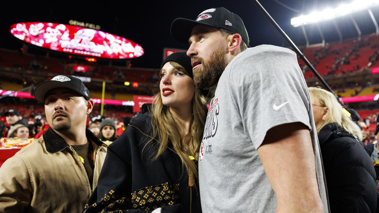 Taylor Swift and Travis Kelce together on the football field after the Superbowl
