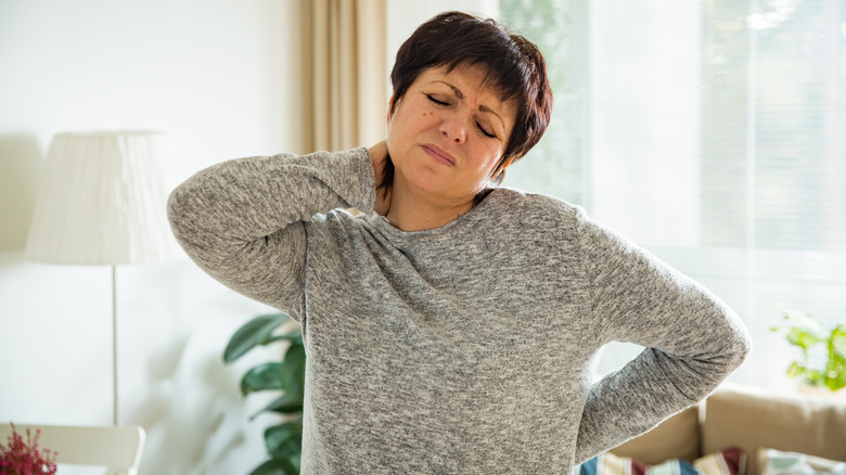 Woman suffering from back pain. 