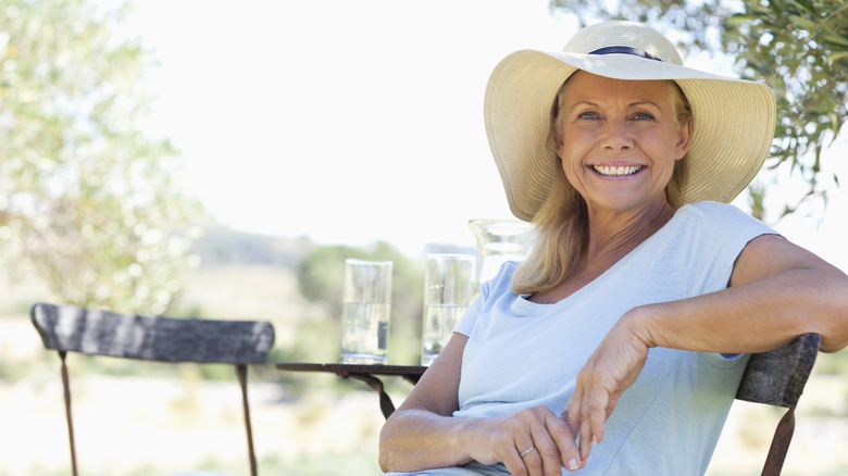 A woman happily smiling.