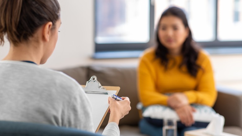 Woman having virtual therapy session