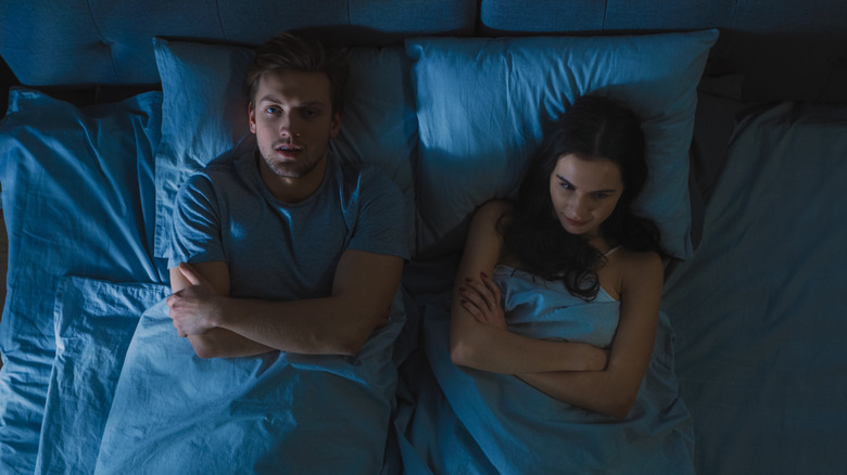 couple awake in bed