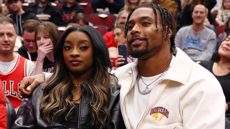 Simone Biles sitting next to Jonathan Owens