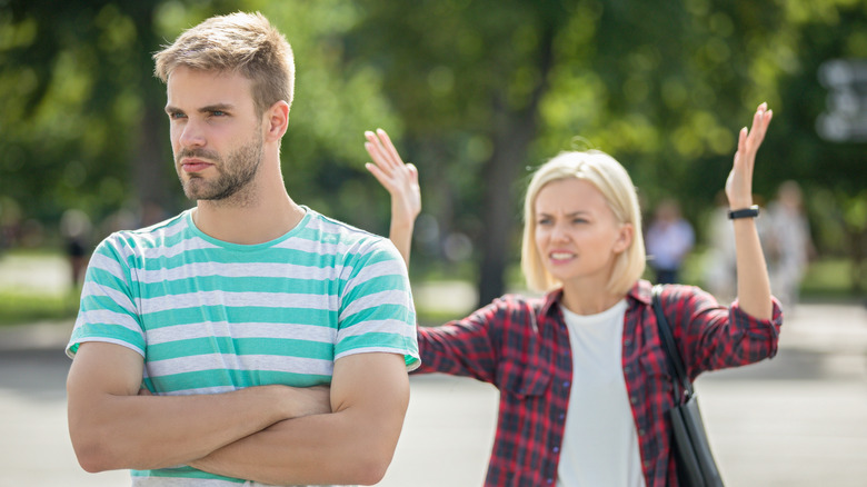 Woman gesturing at a man