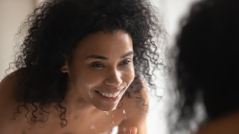 Woman washing her face 