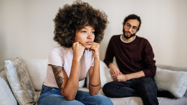Couple on couch upset