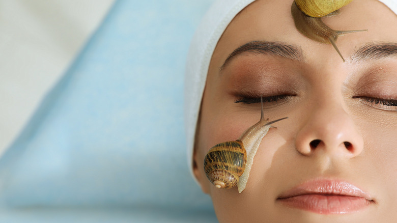 Woman enjoying a snail spa