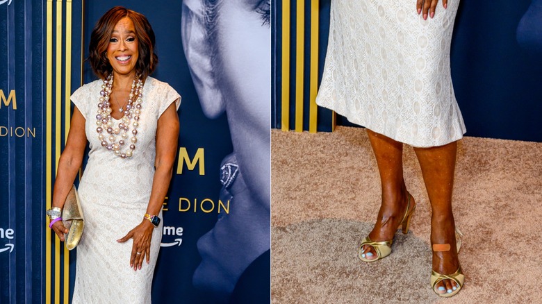 Gayle King smiles in a silver dress wearing gold open-toe heels