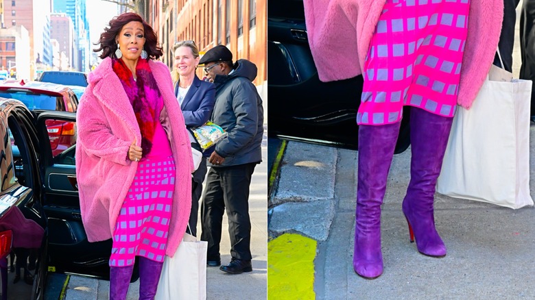 Gayle King wearing a pink-and-purple outfit with purple heels