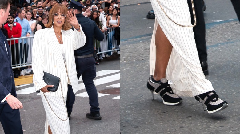 Gayle King wearing a pinstripe suit with sneaker-heels