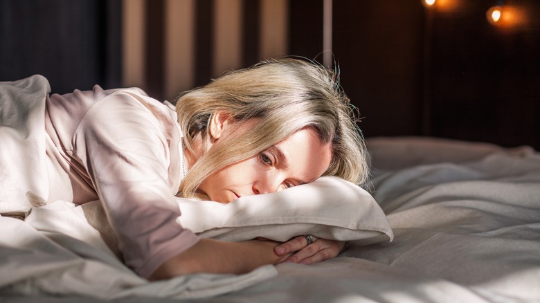 Tired woman waking up