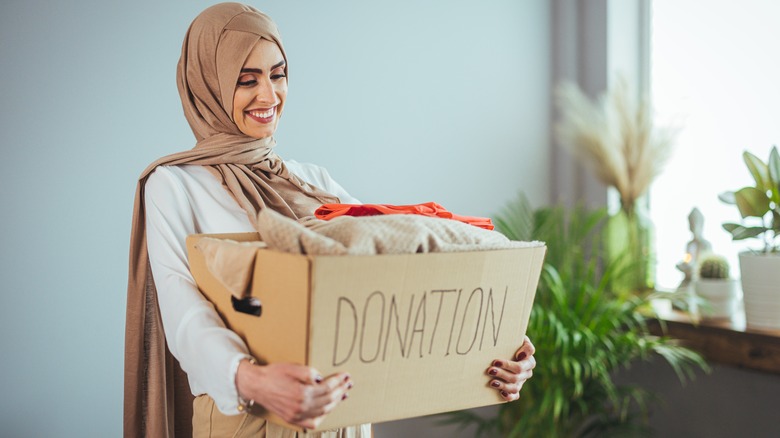 Woman donating clothes