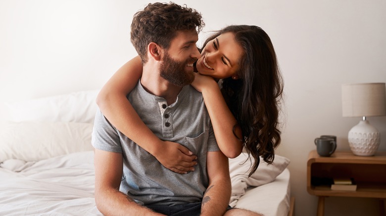 couple embracing in bed