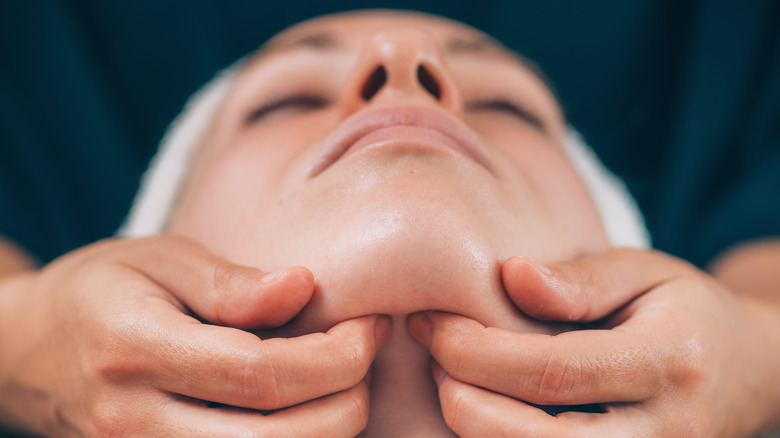 Woman getting a facial massage