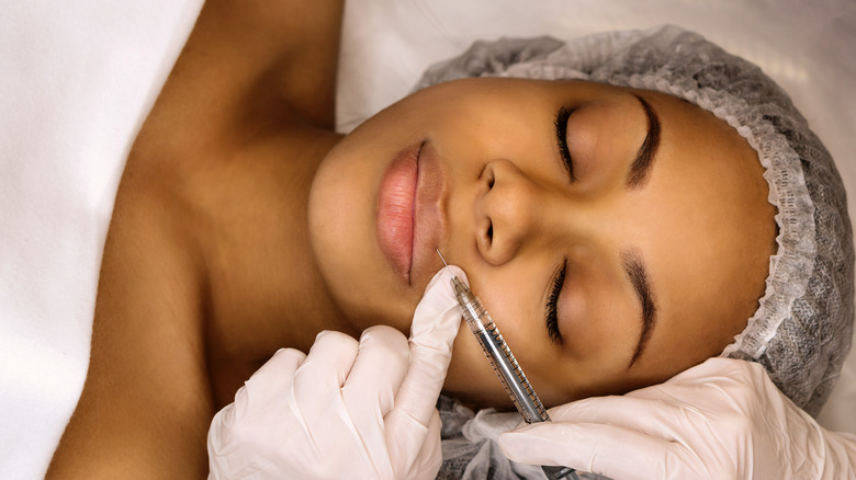 Woman getting lip fillers
