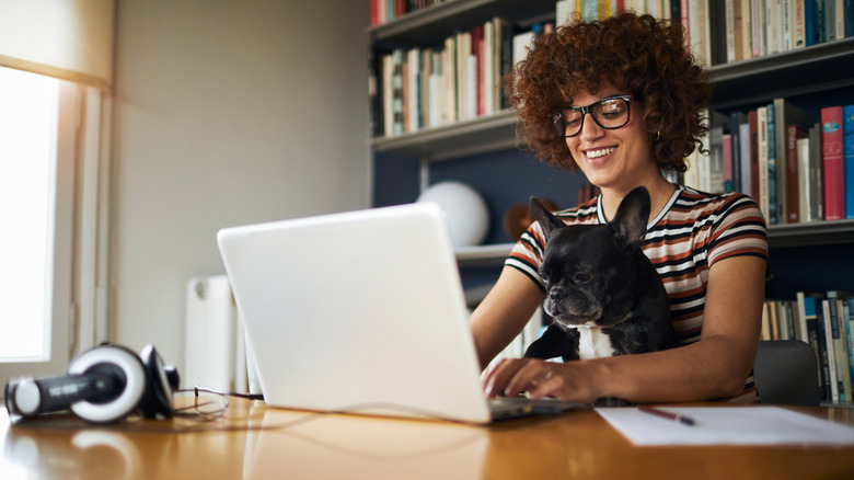 Employee working remote with dog