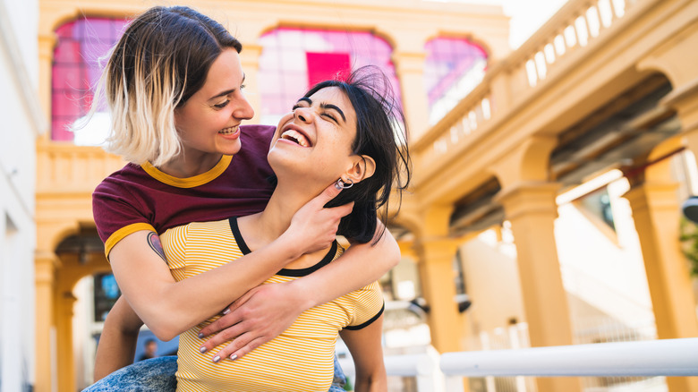 Lesbian couple piggyback 