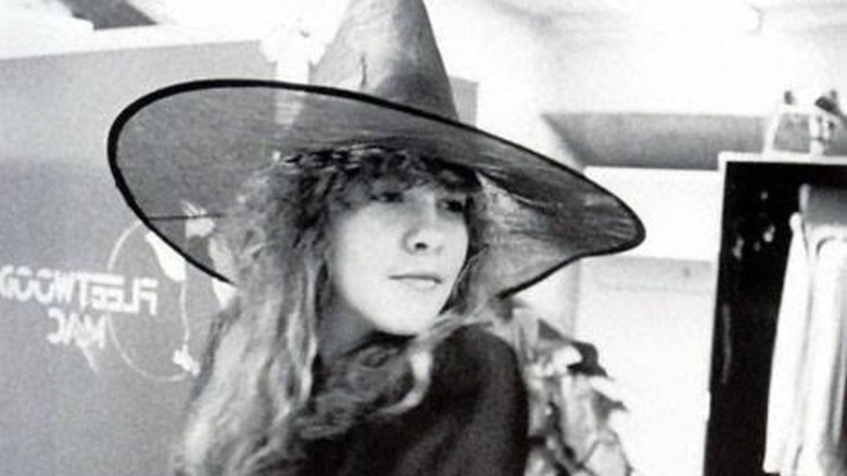 Black-and-white photo showing a young Stevie Nicks dressed as a witch