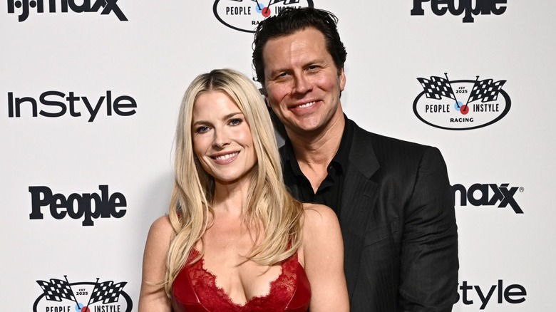 Hayes McArthur with his arms around Ali Larter on the red carpet