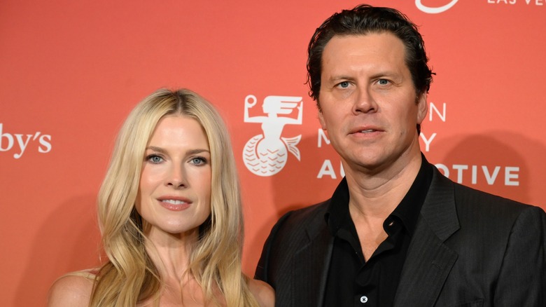 Ali Larter and Hayes MacArthur posing on the red carpet together