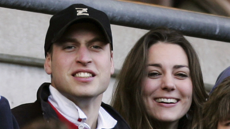 Prince William in a baseball cap and Kate Middleton at an event
