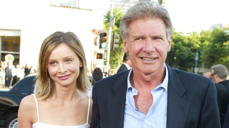 Calista Flockhart and Harrison Ford posing together on the red carpet