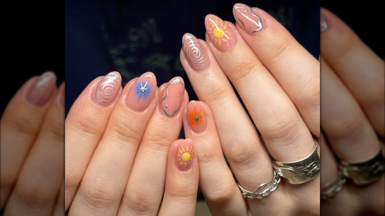 Hands with shimmery, milky nails