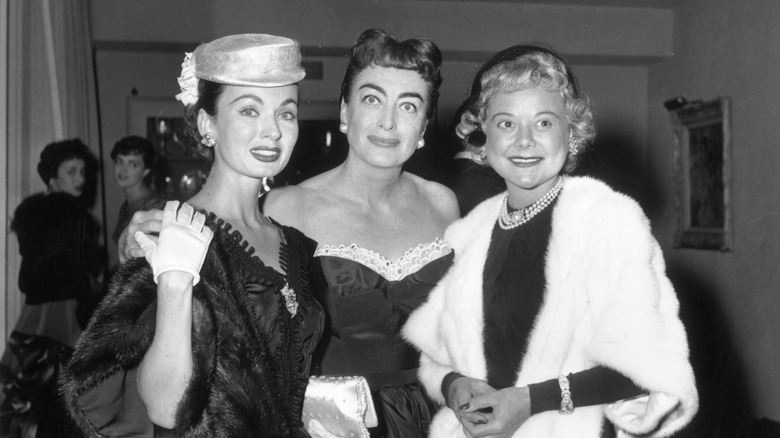 Ann Blyth, Joan Crawford and another woman at an event in 1951
