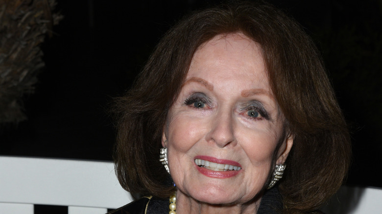 A close up of Ann Blyth at an event in old age